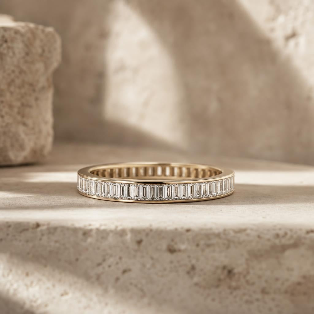 Row of rectangular baguette-cut stones set in a sterling silver wedding band