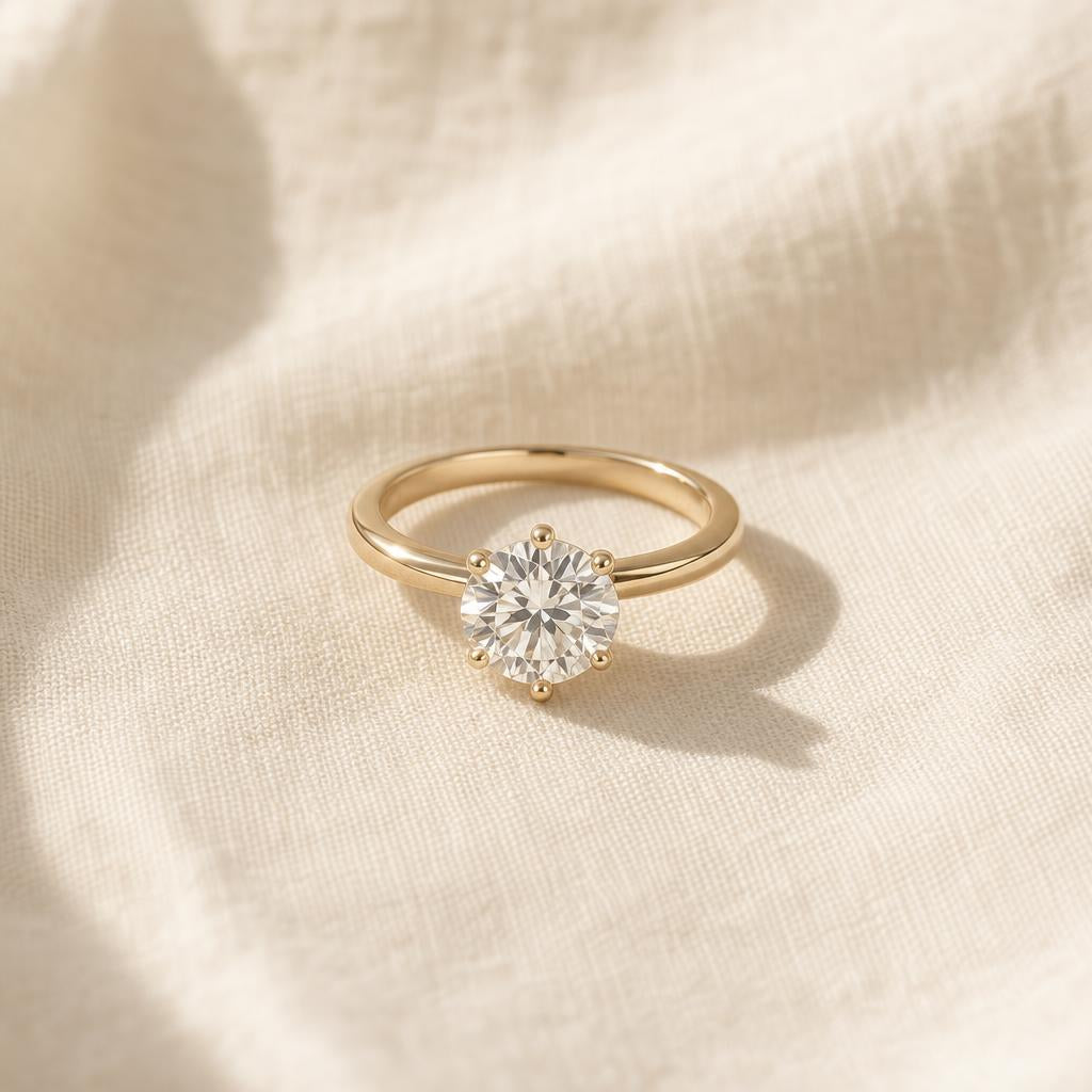 Sparkling diamond ring resting on cream linen in soft window light