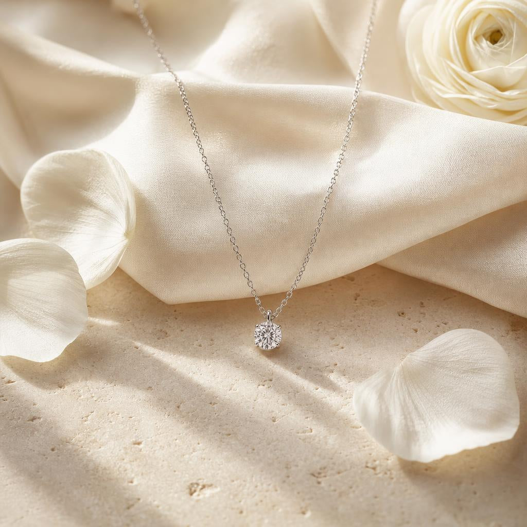 Fine silver pendant necklace on ivory silk with white petals