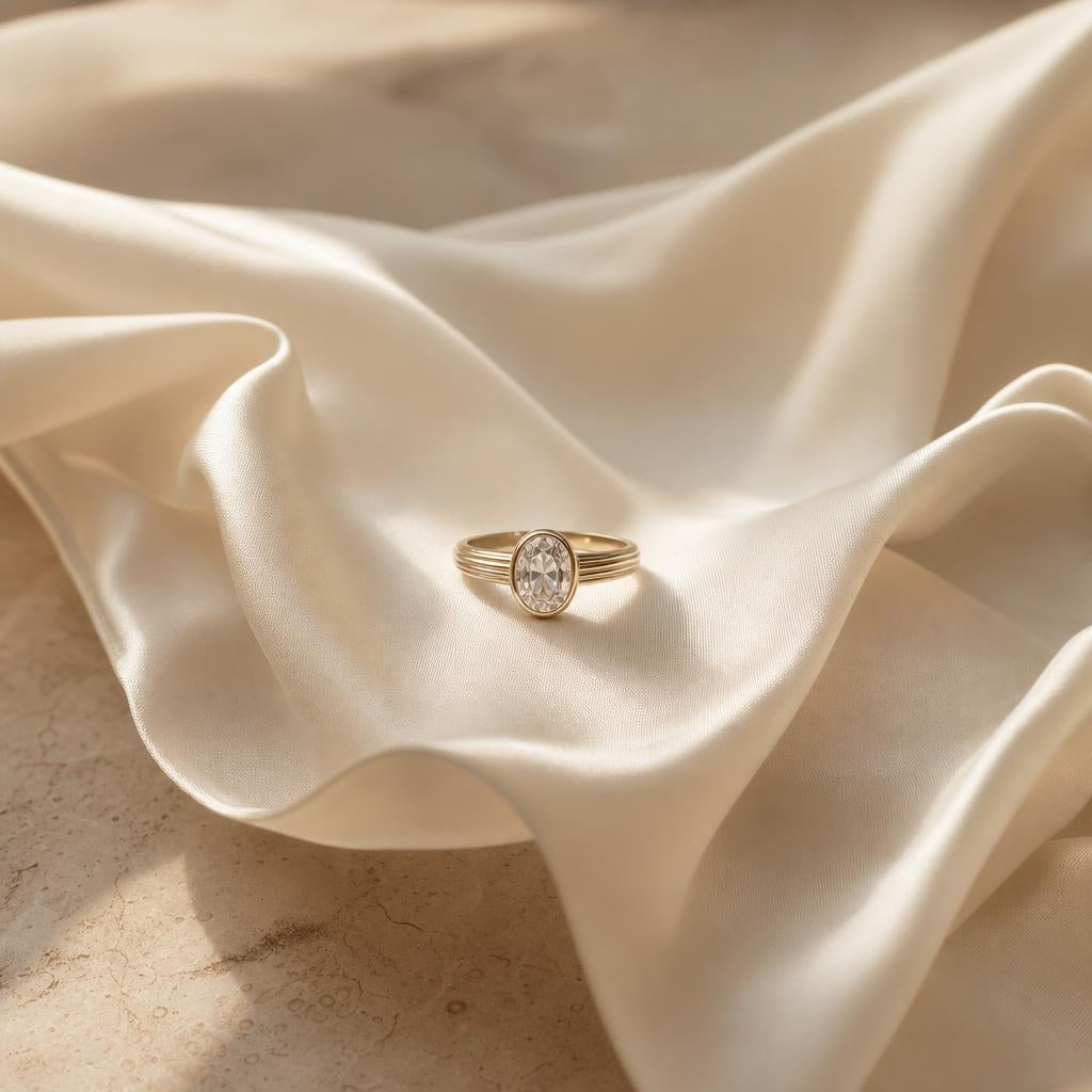 Elegant ring centered on cream fabric with soft warm light
