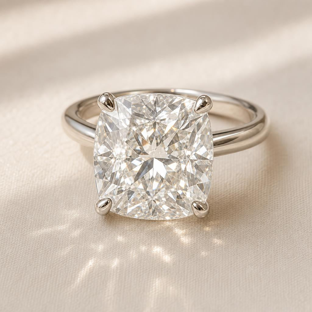 Cushion cut diamond ring on cream linen surface in soft natural light