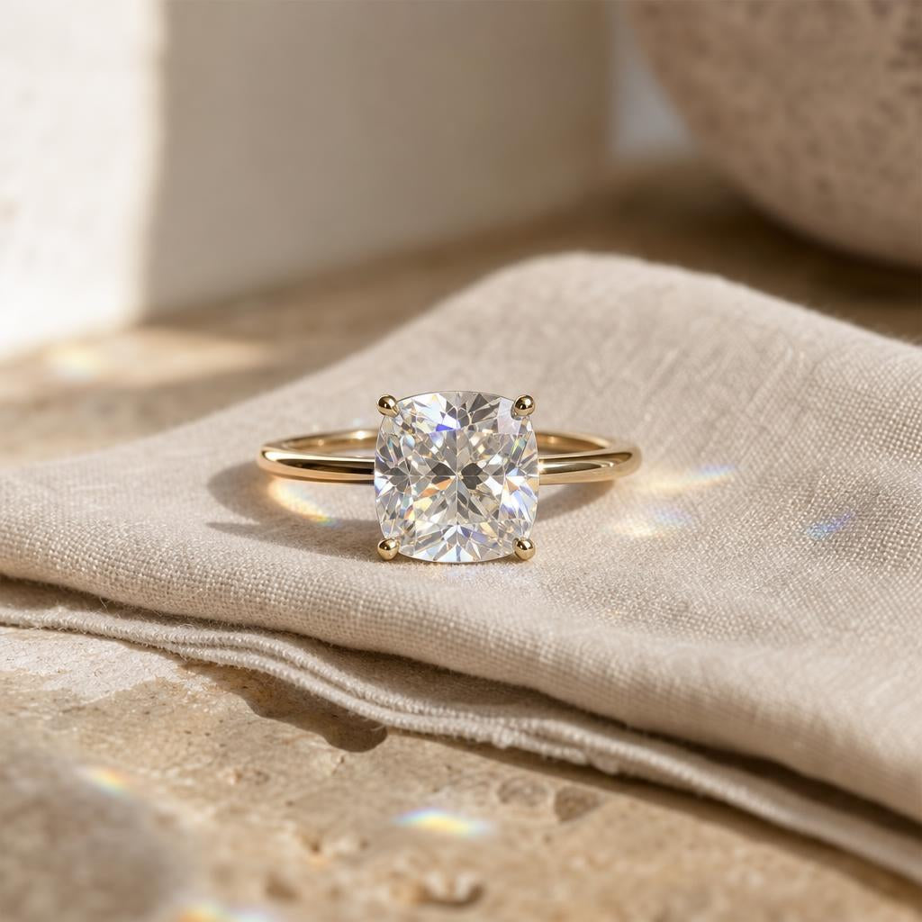 Cushion-cut sparkling ring on cream linen in soft natural light