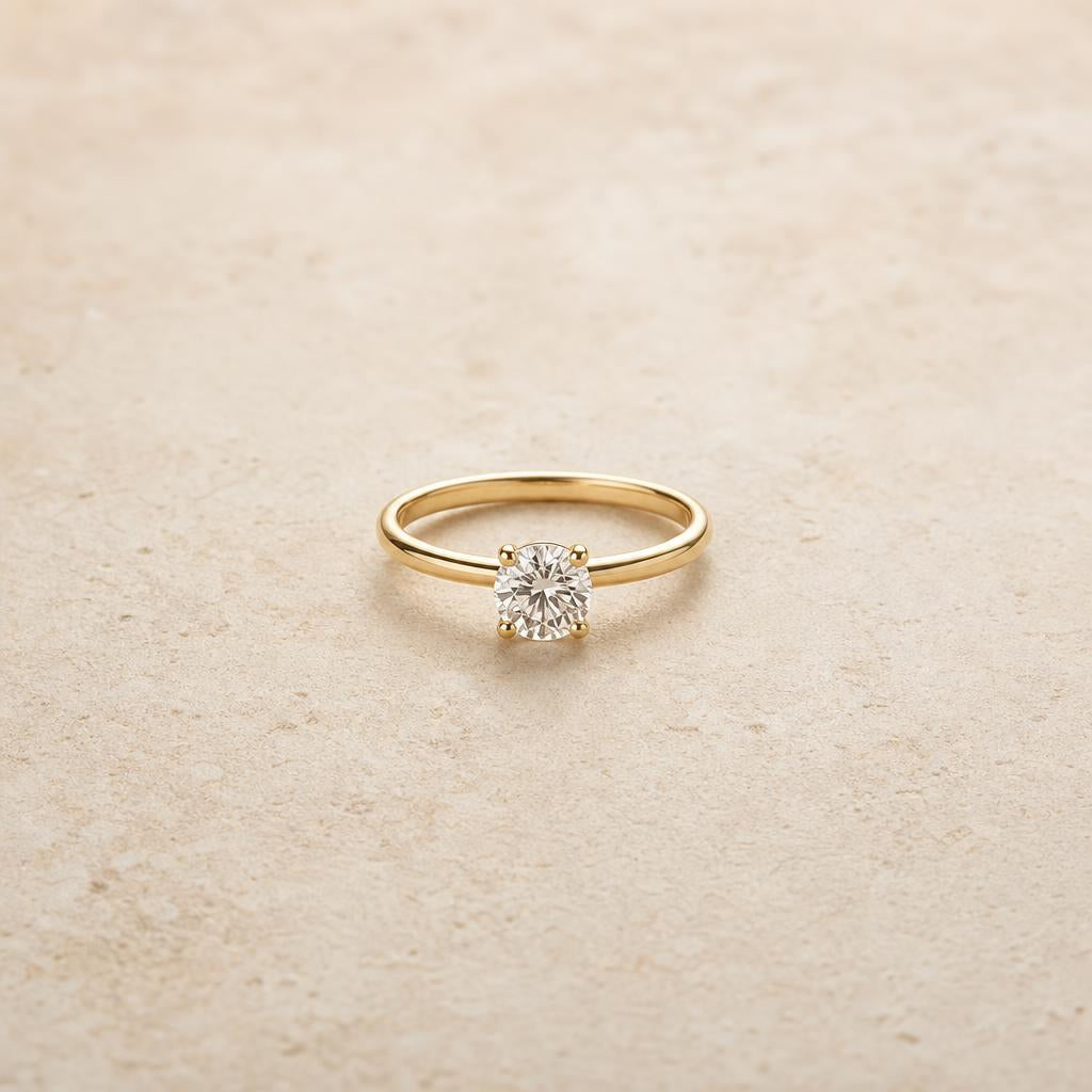 Single solitaire ring centered on a warm neutral background, no halo