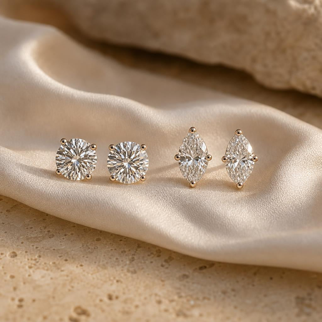 Round and marquise sterling silver stud earrings side by side