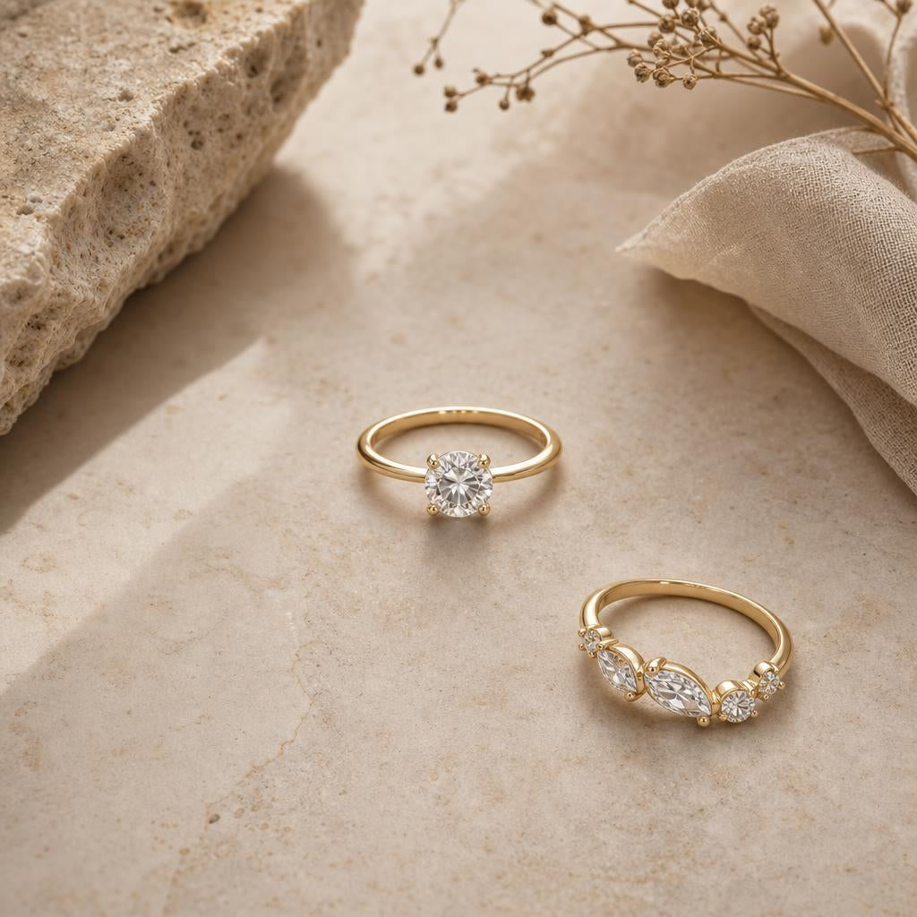 Two rings on warm stone background, one centered symmetrically, one placed asymmetrically