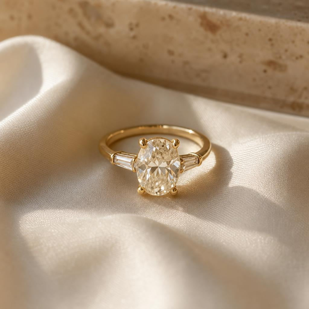 Simulated diamond ring resting on soft cream silk in warm natural light